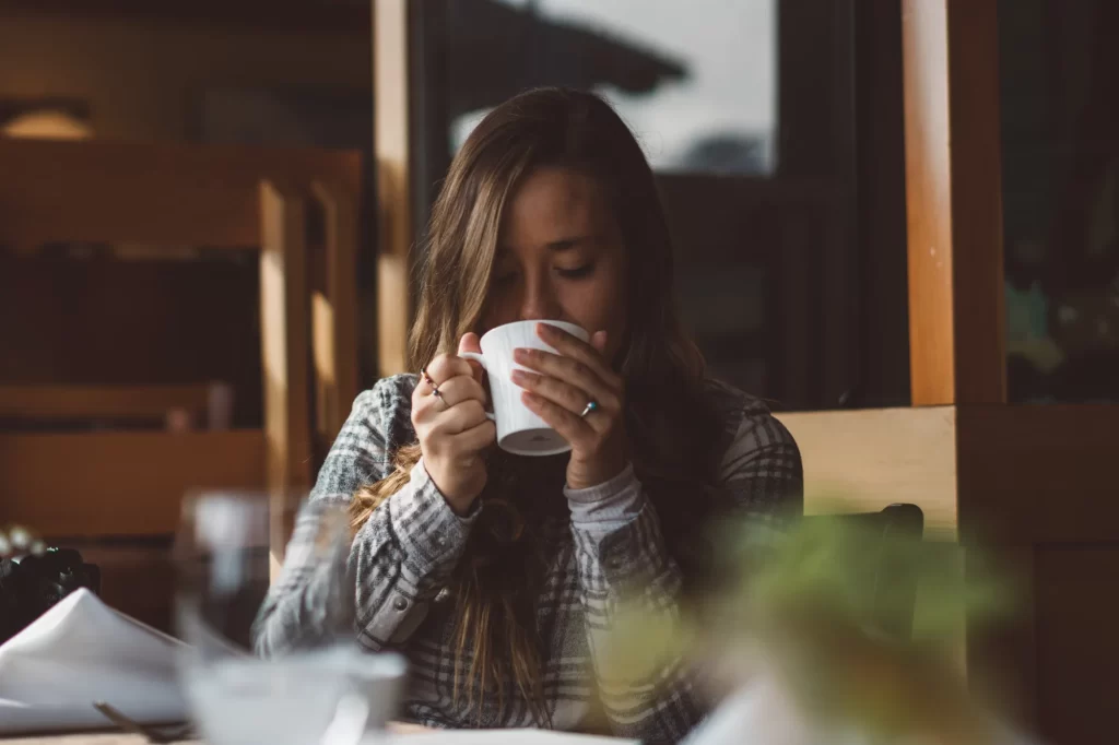 a woman sipping coffee