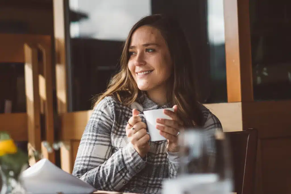 Visitor Enjoys Warm Beverage | Tyler Cave | Destination Campbell River